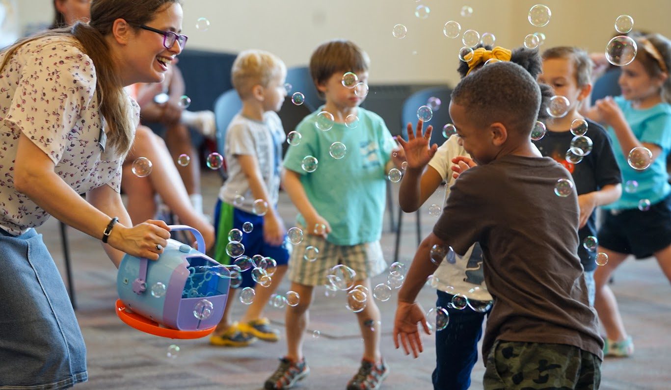 Children playing with bubbles at Penn Hills Library.